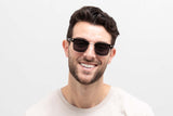 Man wearing Black Jaguar Sunglasses, Browline Sunglasses with grey polarized lenses - Front view on white background