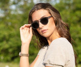 Woman wearing Kraywoods Ash, Rounded Aviator Wood Sunglasses with grey polarized lenses - Front view