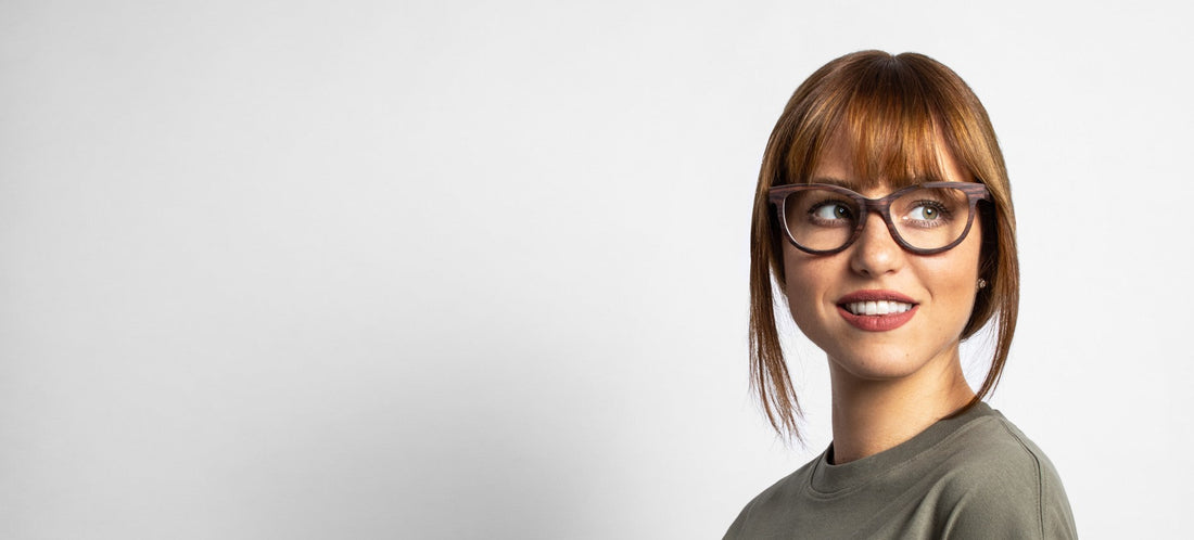 woman wearing Charm Purple, wooden cat eye browline glasses on a white background