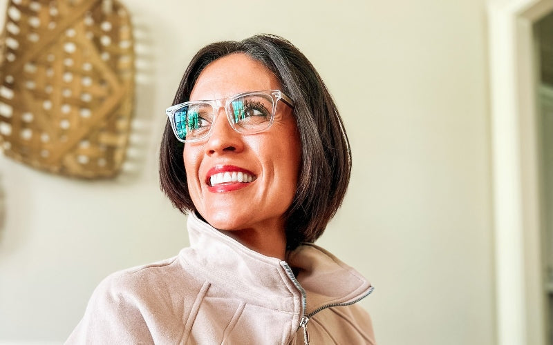 side profile picture of woman wearing blue light glasses