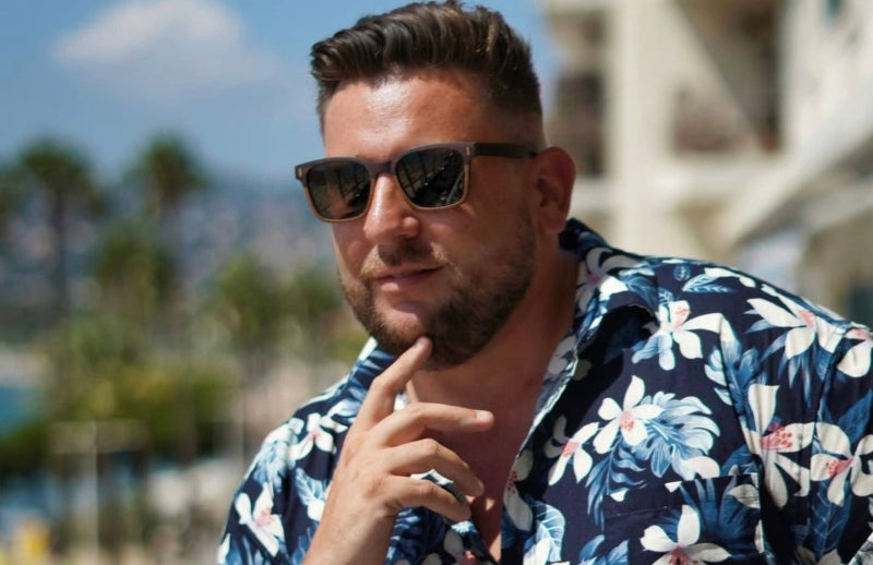 man on vacation wearing sunglasses 