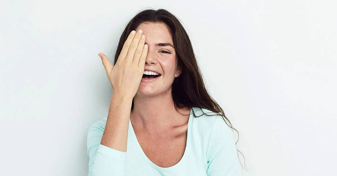 Woman covering an eye. totest her dominant eye