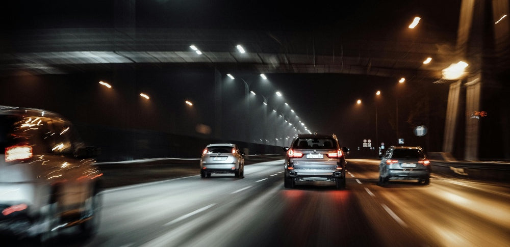 Cars driving in tunnel at night