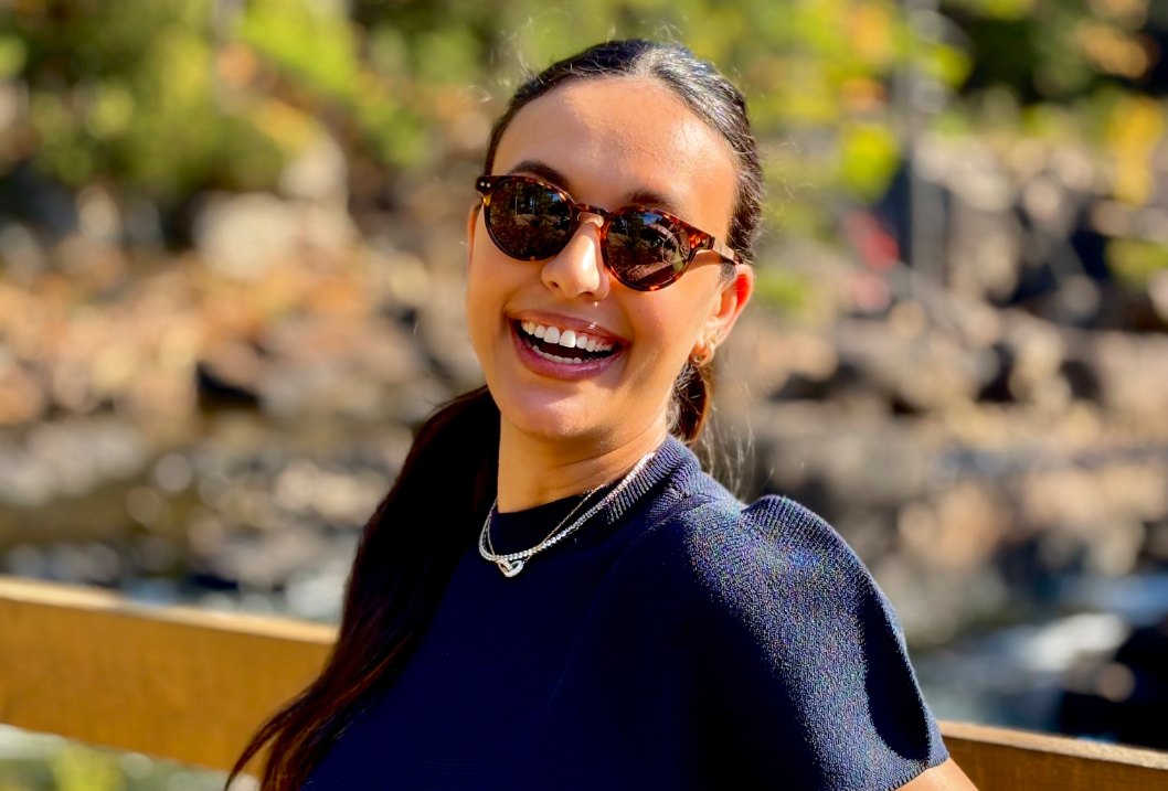 Woman with round face shape wearing sunglasses