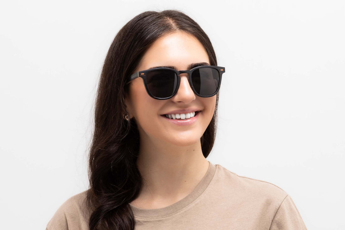 Woman wearing Hunter Black Sunglasses, retro square wooden sunglasses with grey polarized lens