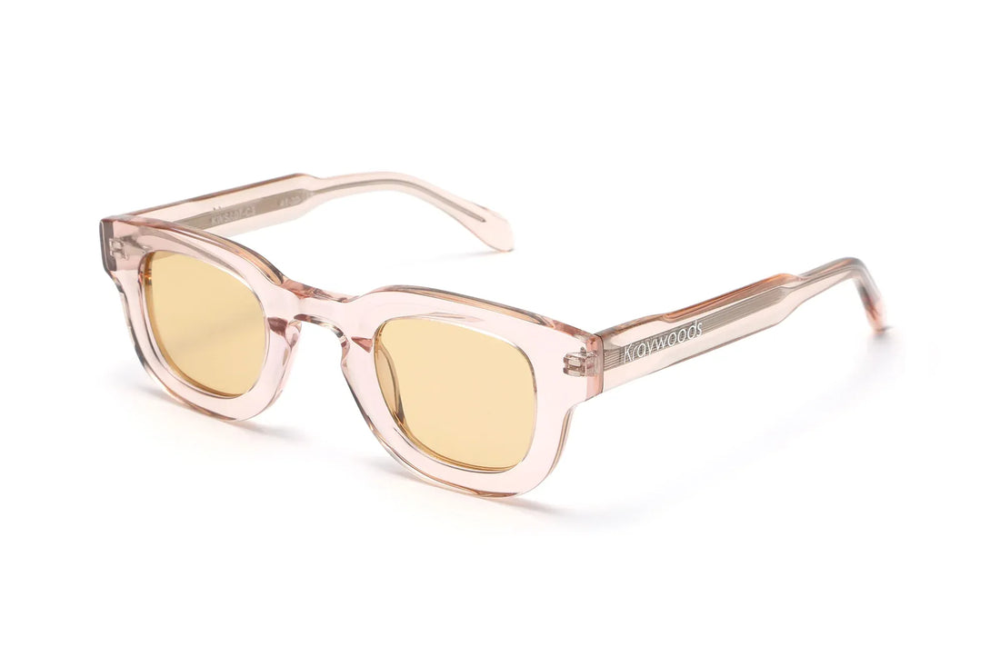 Juno Pink Sunglasses, thick rounded pink sunglasses with light pink lens - oblique view on white background