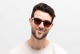 Man wearing Juno Brown Sunglasses, thick square tortoiseshell sunglasses with brown polarized lens