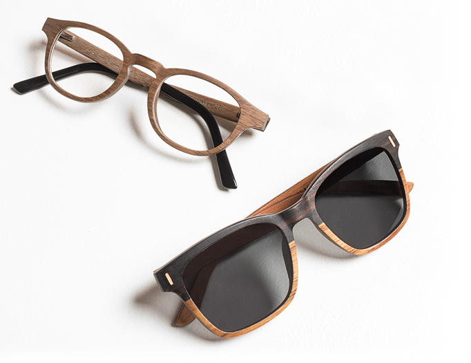 A hand graphic holding a globe pointing to Kenya